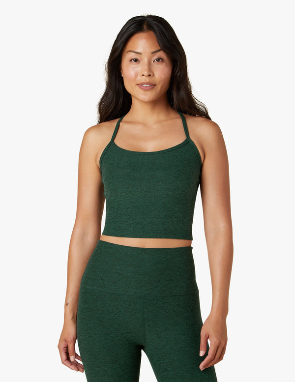 Female model wearing forest green pine tank from Beyond Yoga