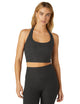 Woman wearing Beyond Yoga Darkest Night halter top and darkest night yoga leggings. 