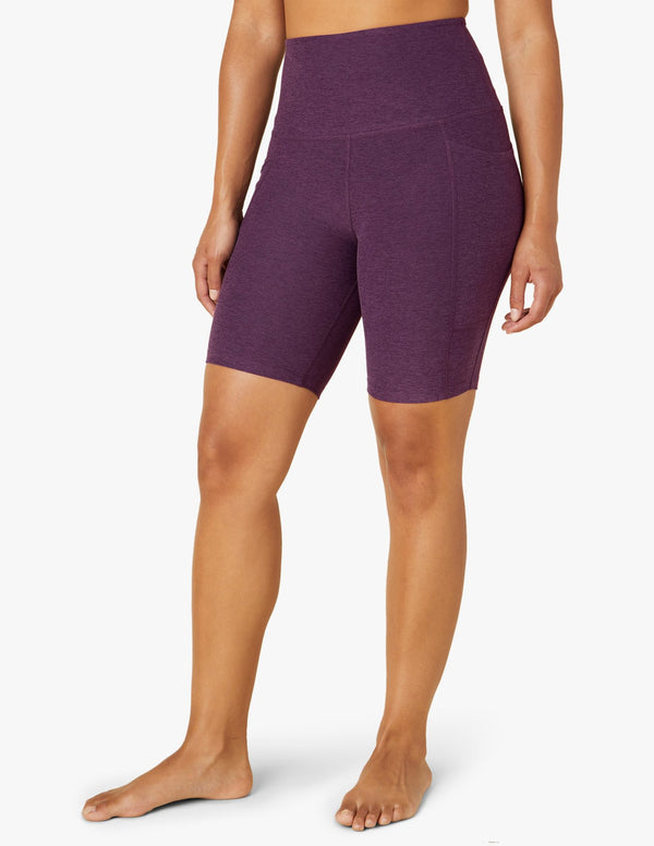 female model wearing purple twilight biker shorts from beyond yoga