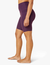 Load image into Gallery viewer, female model wearing purple twilight biker shorts from beyond yoga