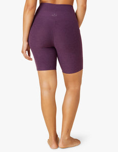 female model wearing purple twilight biker shorts from beyond yoga
