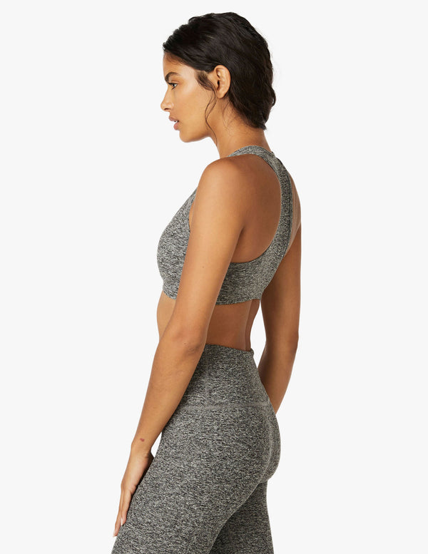 female model wearing gray sports bra from beyond yoga