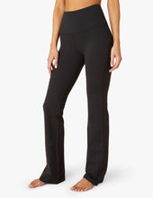 Load image into Gallery viewer, female model wearing black high waisted pant from beyond yoga