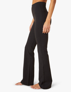 female model wearing black high waisted pant from beyond yoga