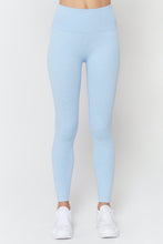 Load image into Gallery viewer, Female model wearing pastel blue leggings from spiritual gangster