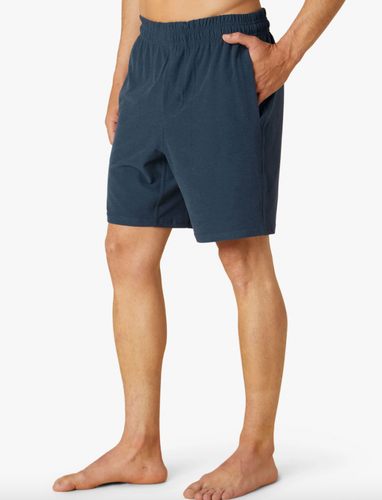 Man wearing Beyond Yoga Navy shorts