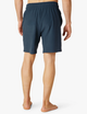 Back image of man wearing navy Beyond Yoga shorts