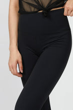 Load image into Gallery viewer, Female model wearing black Nita leggings from Varley