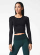 Female model wearing black long sleeve from Nux Active Clothing