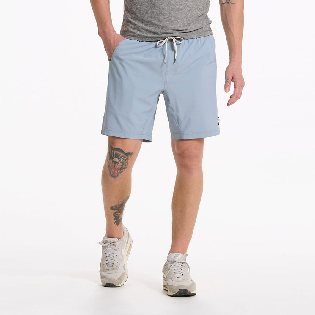 athletic man wearing light blue shorts