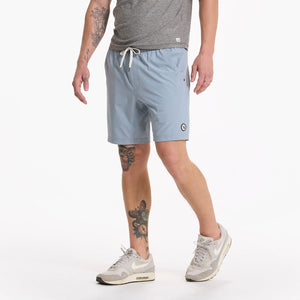 male model wearing light blue athletic shorts