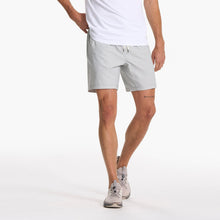 Load image into Gallery viewer, man wearing a white tshirt with vuori shorts and light grey sneakers