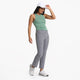 Female model wearing light green tank from Vuori