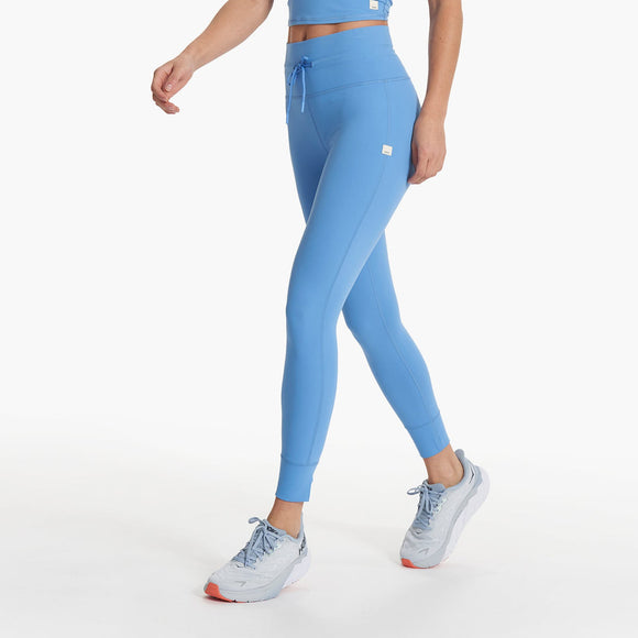 Side view of Blue Vuori leggings