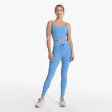 Load image into Gallery viewer, Photo of woman wearing blue vuori leggings and blue top. 