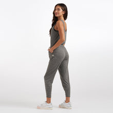 Load image into Gallery viewer, Female model wearing gray jumpsuit from Vuori