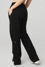 Load image into Gallery viewer, Female model wearing Alo Yoga black snap pant