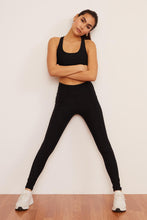 Load image into Gallery viewer, Female model wearing black pocket legging from wolven