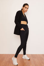 Load image into Gallery viewer, Female model wearing black pocket legging from wolven