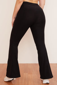 Female model wearing black flare pant from wolven