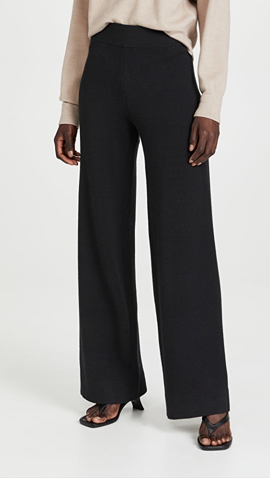 Female model wearing black structured lounge pant 