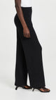 Female model wearing black structured lounge pant 