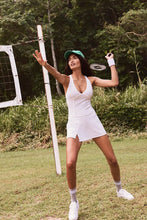 Load image into Gallery viewer, Female model wearing white tennis skort dress from free people
