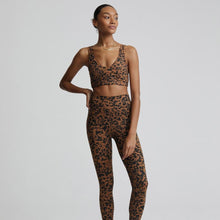 Load image into Gallery viewer, Female model wearing bronzed cheetah leggings from Varley